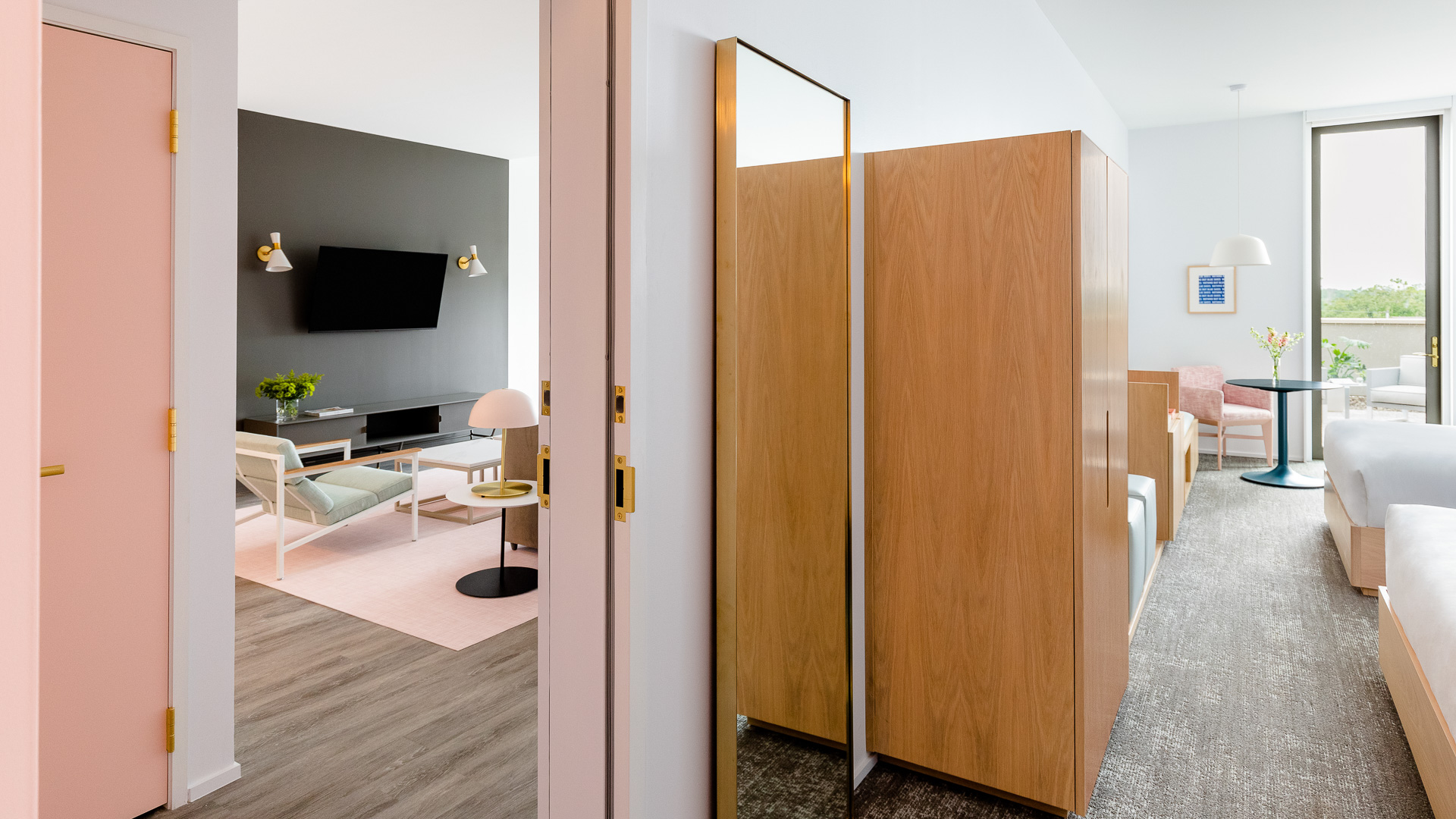 a room with a tv and a mirror