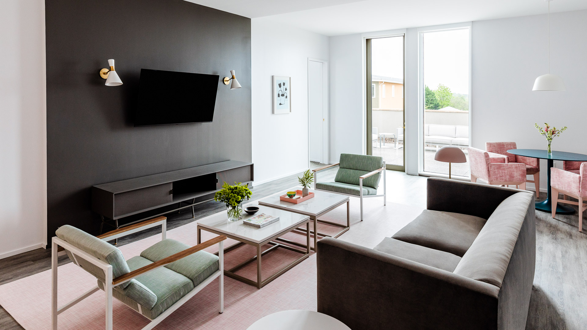 a living room with a television and couches