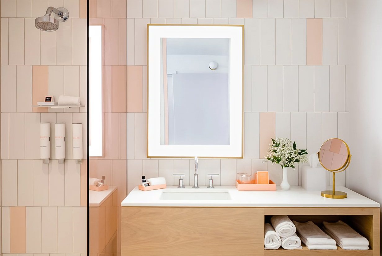 a bathroom with a mirror and a sink