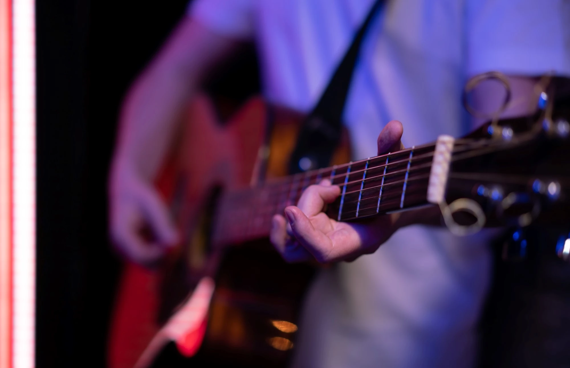 a person playing a guitar