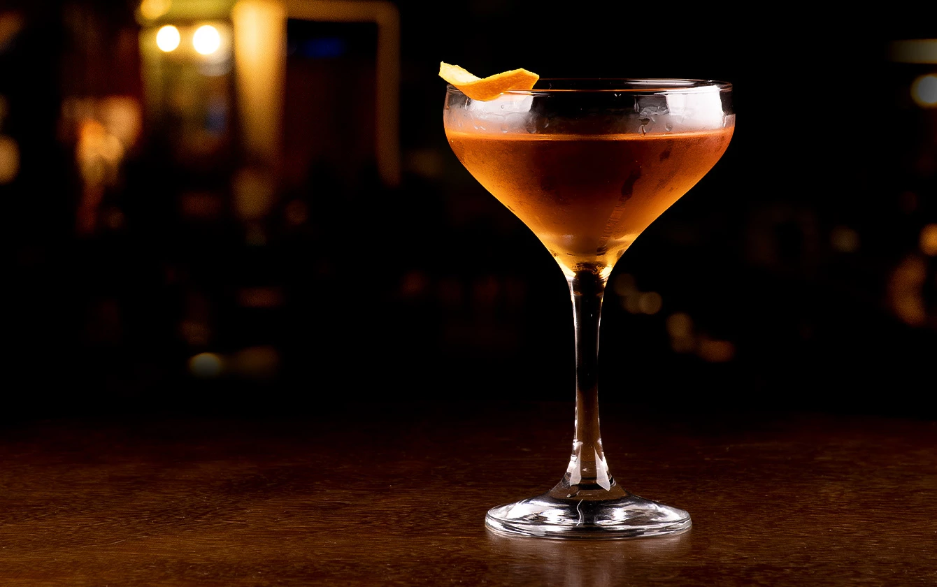 a glass of orange drink