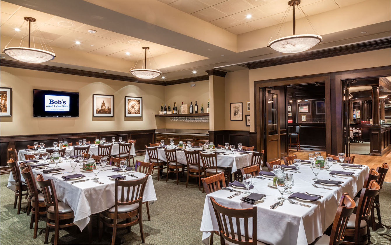 a room with tables and chairs