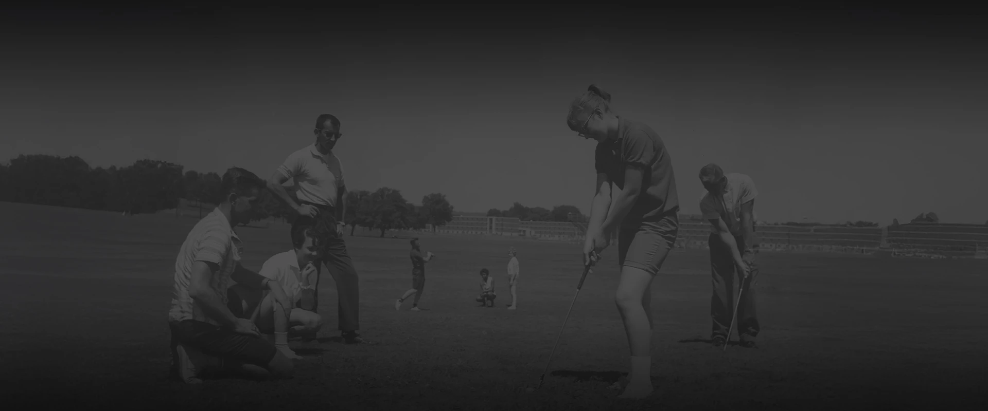 a group of people playing golf