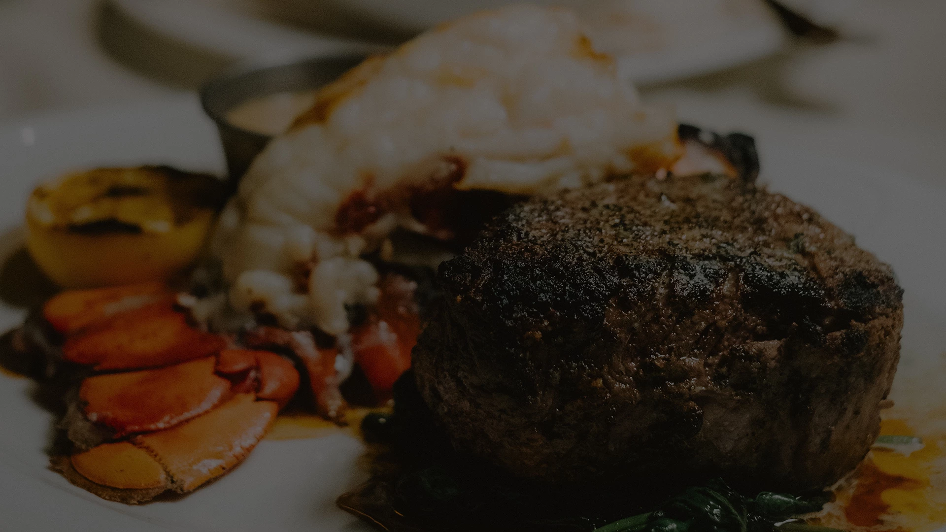 a plate of food with a piece of meat