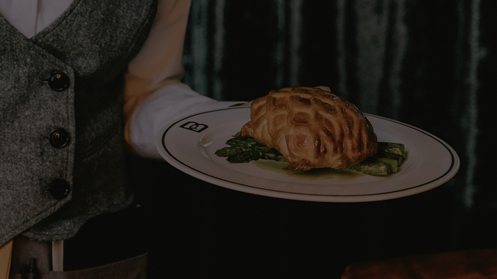 a plate of food on a person's hand