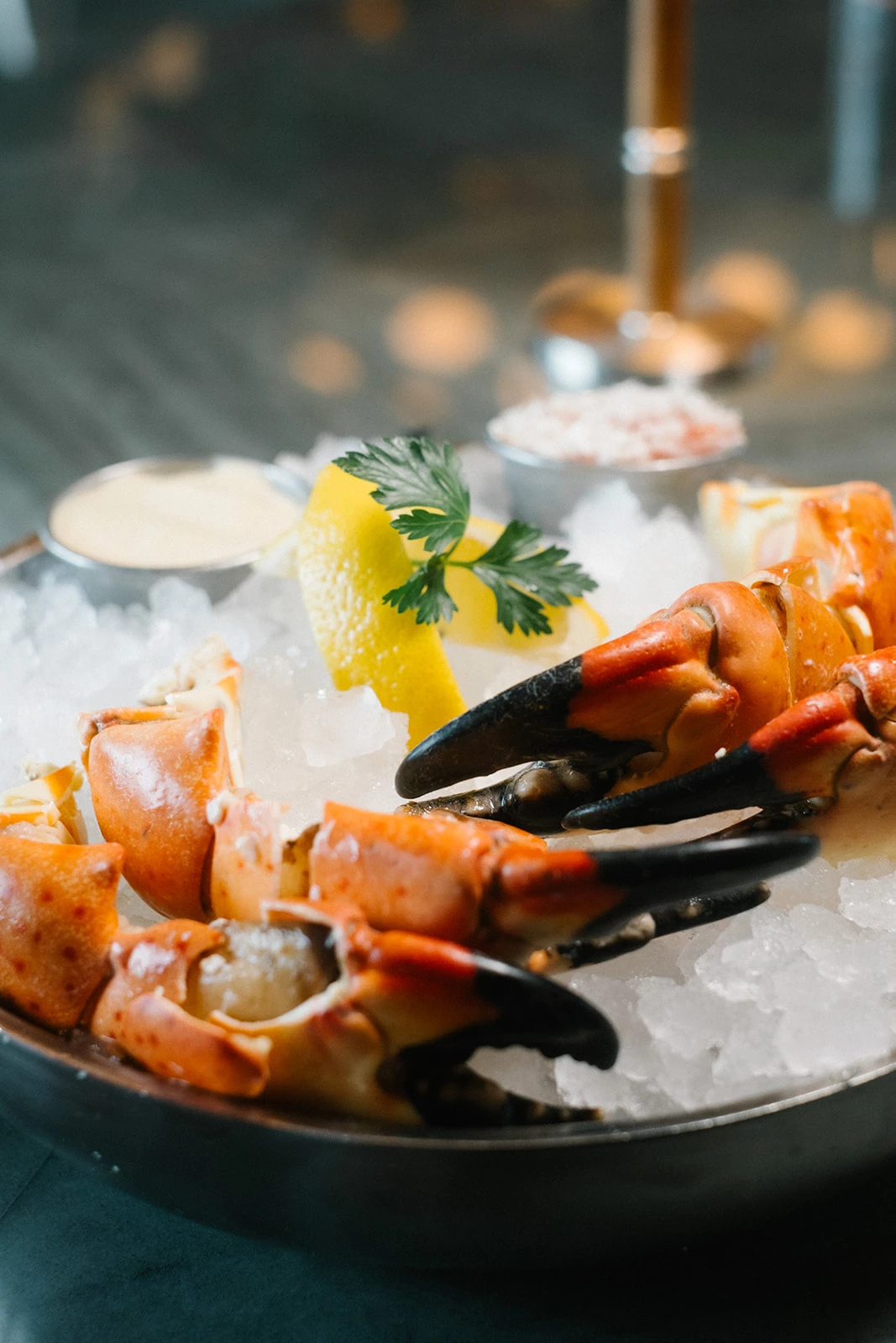a bowl of crab claws on ice