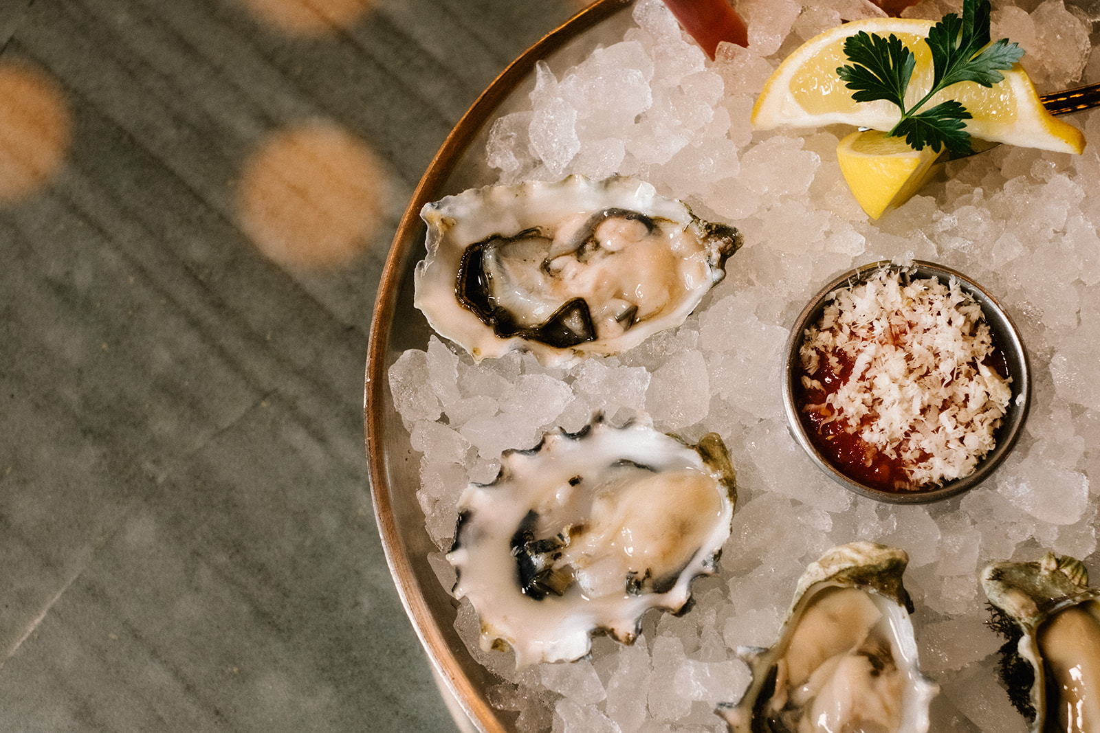 a plate of oysters and sauces