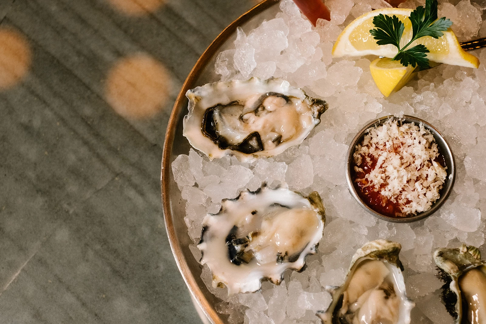 a plate of oysters and sauces