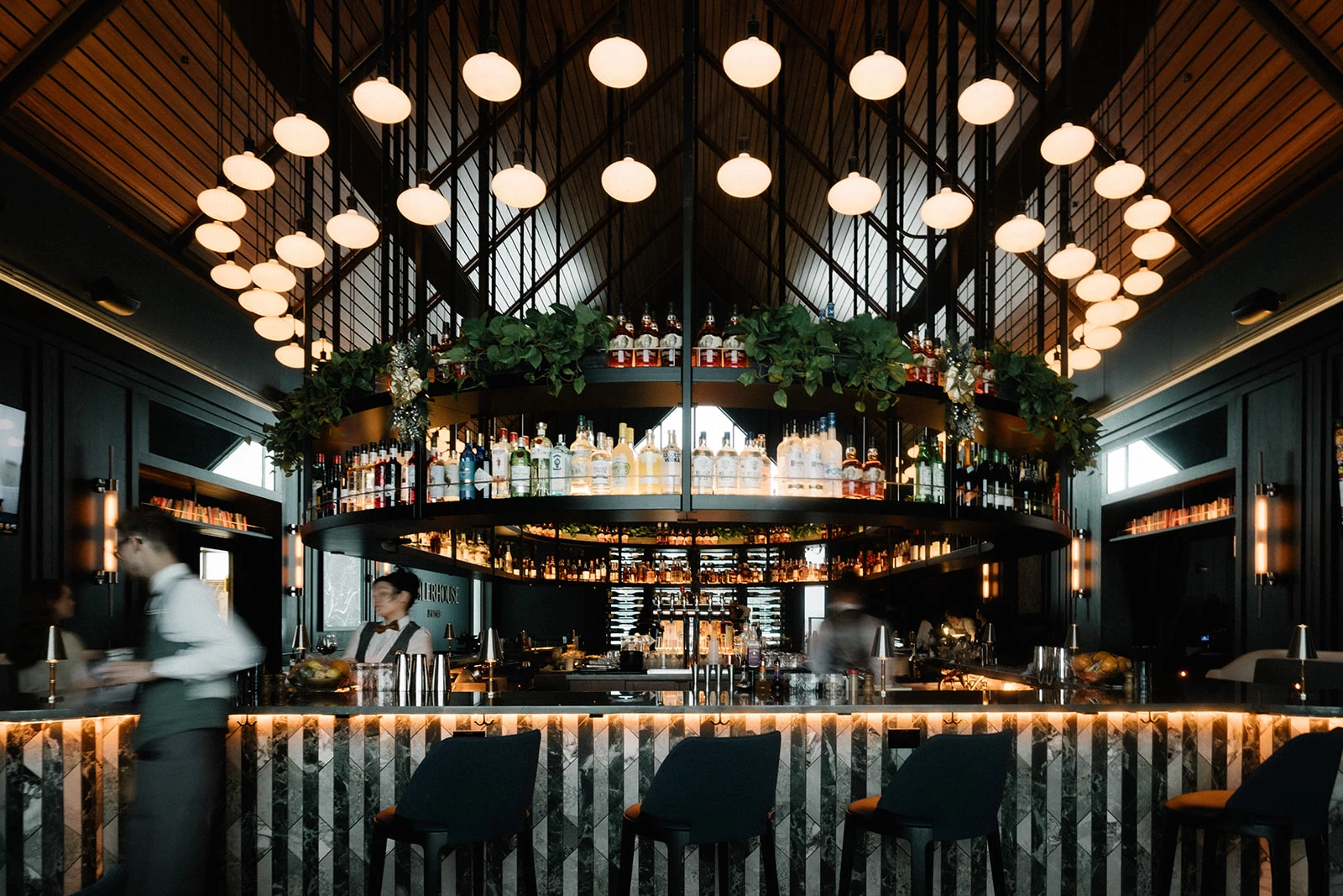 a bar with lights and a bar counter