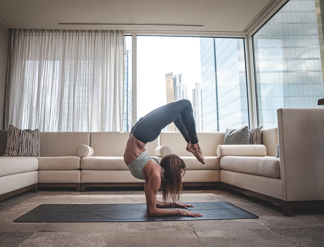 a woman doing yoga in a living room
