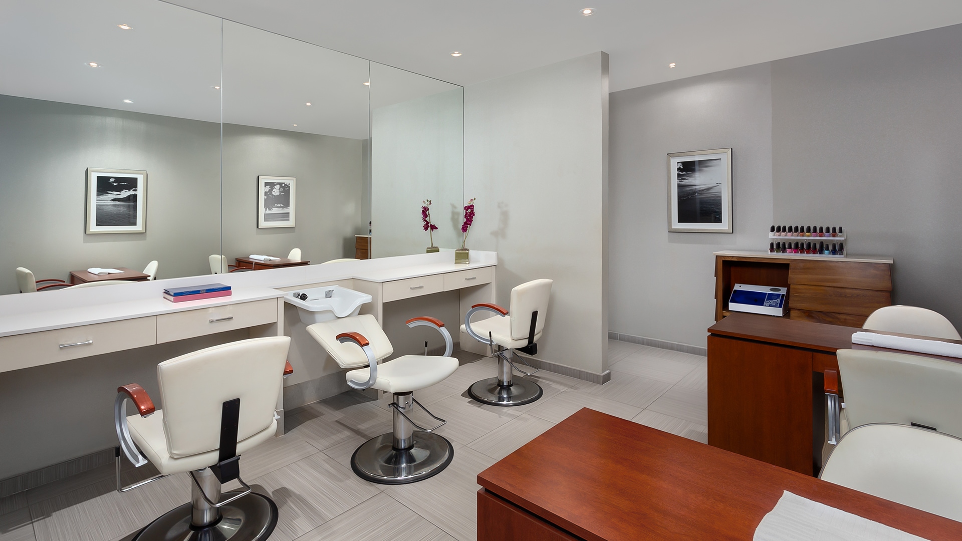 a room with a mirror and chairs