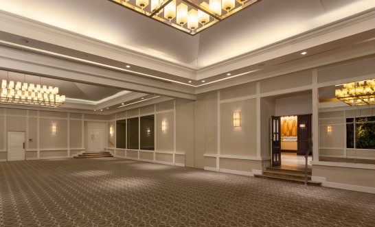 a room with a large ceiling and stairs