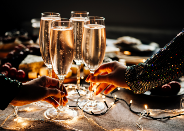 a group of people holding champagne glasses