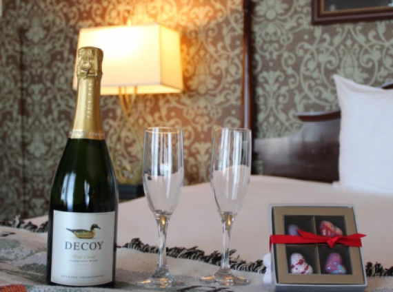 a bottle of champagne and two glasses