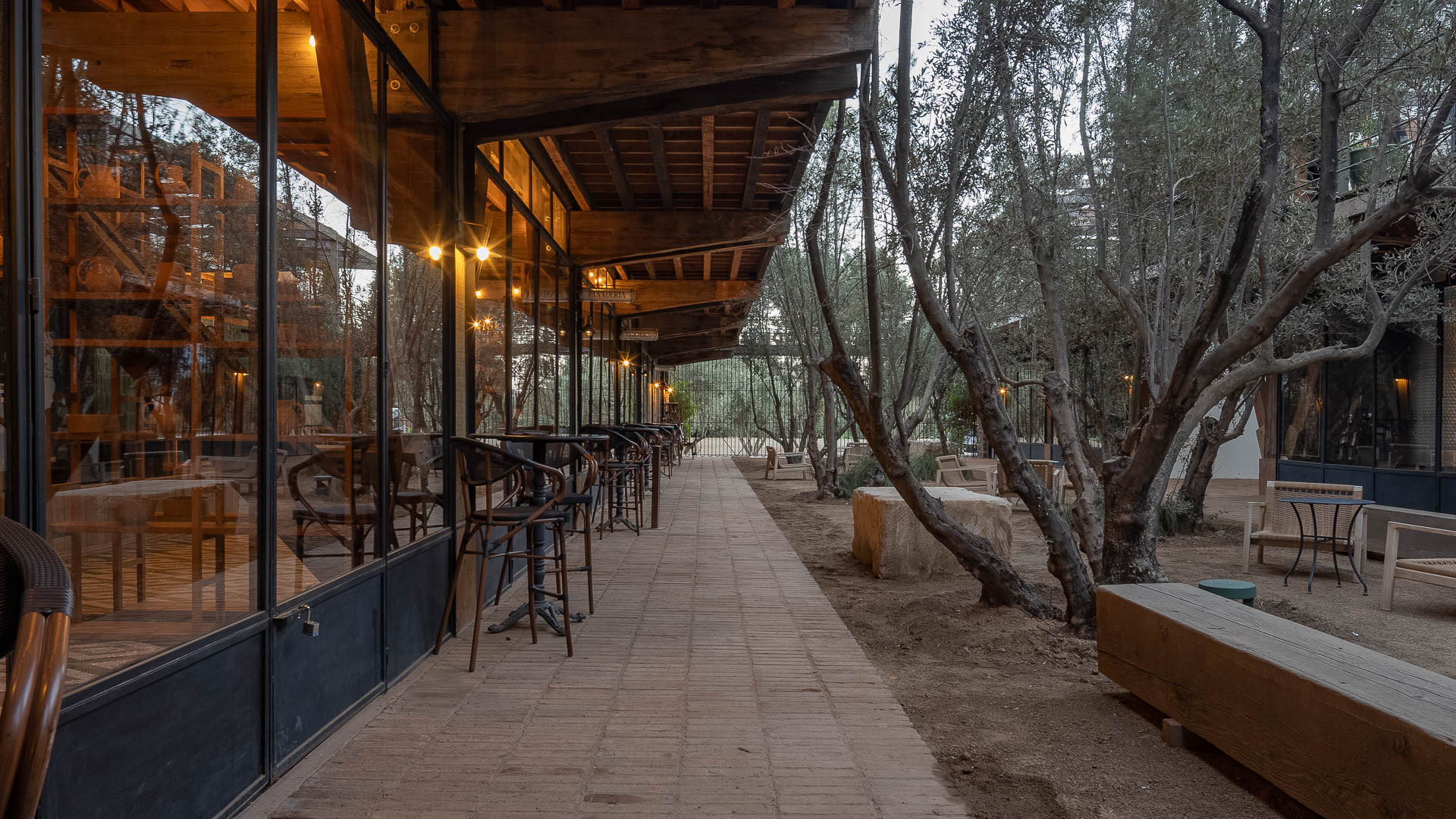 a patio with tables and chairs