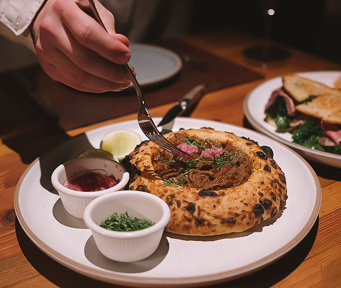 a person eating food on a plate