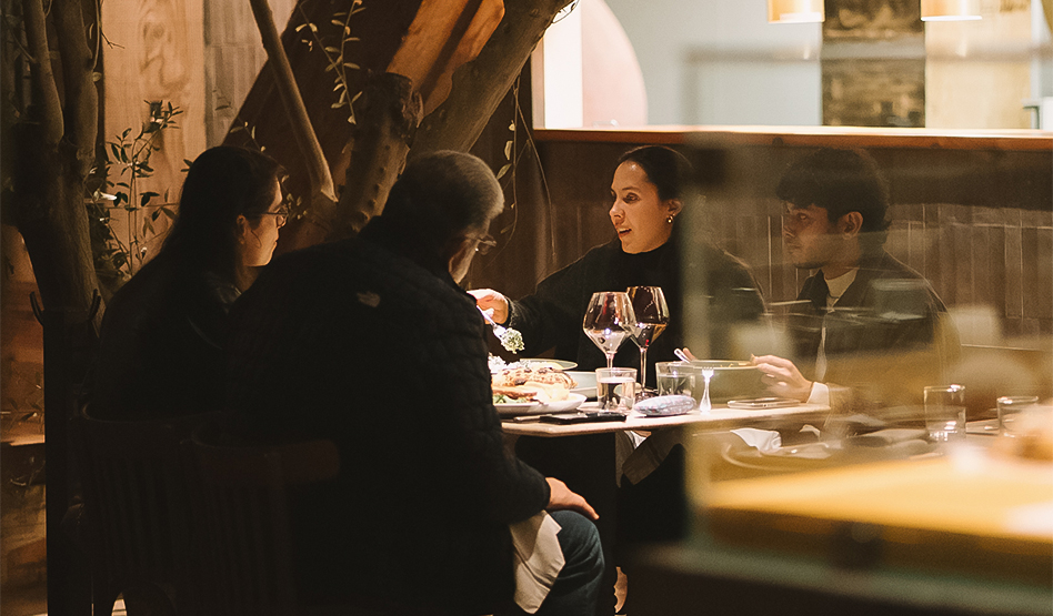 a group of people sitting at a table