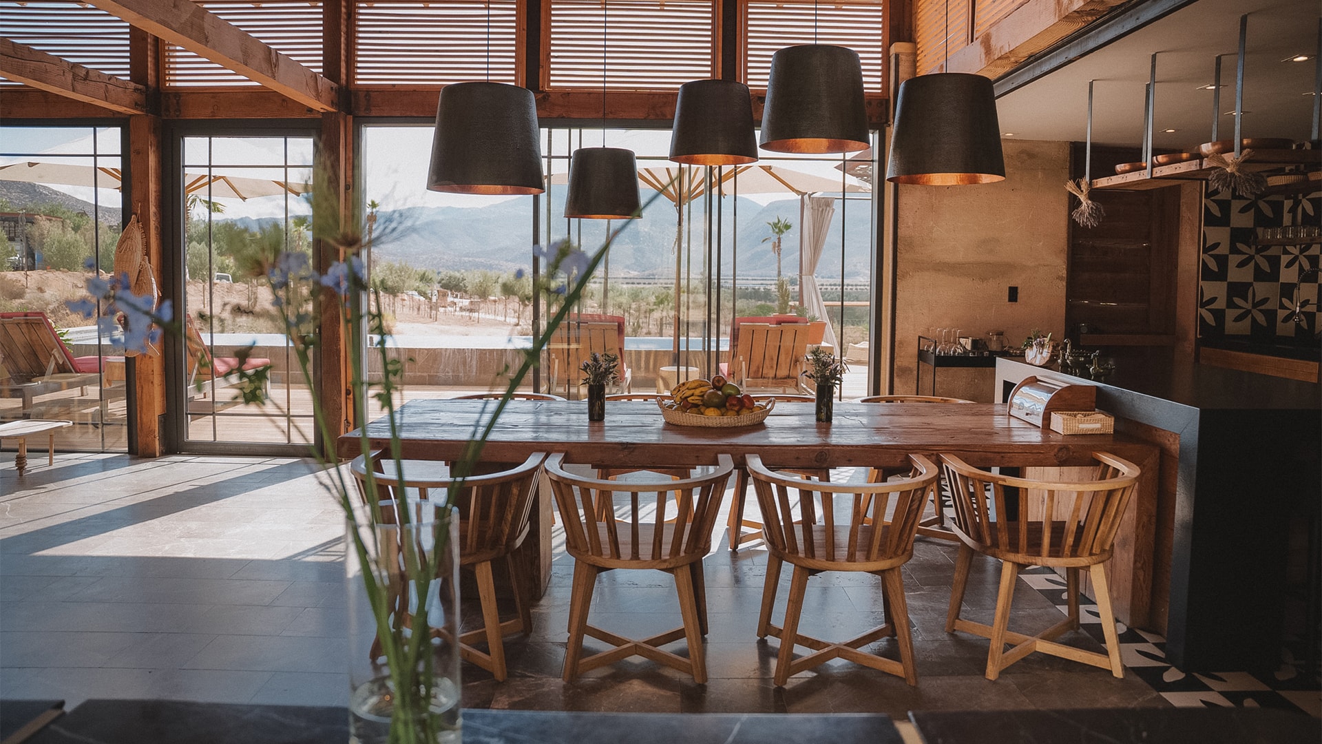 a dining room with a table and chairs