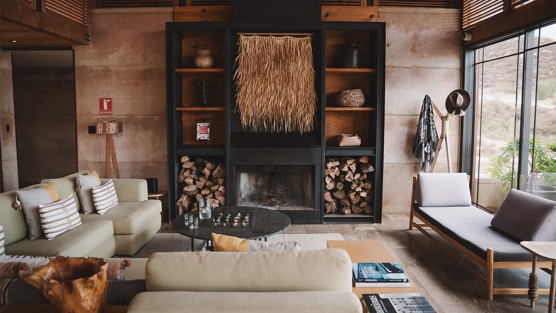 a room with a fireplace and couches