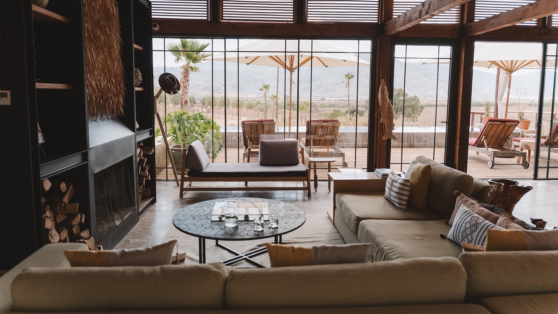 a living room with a fireplace and couches