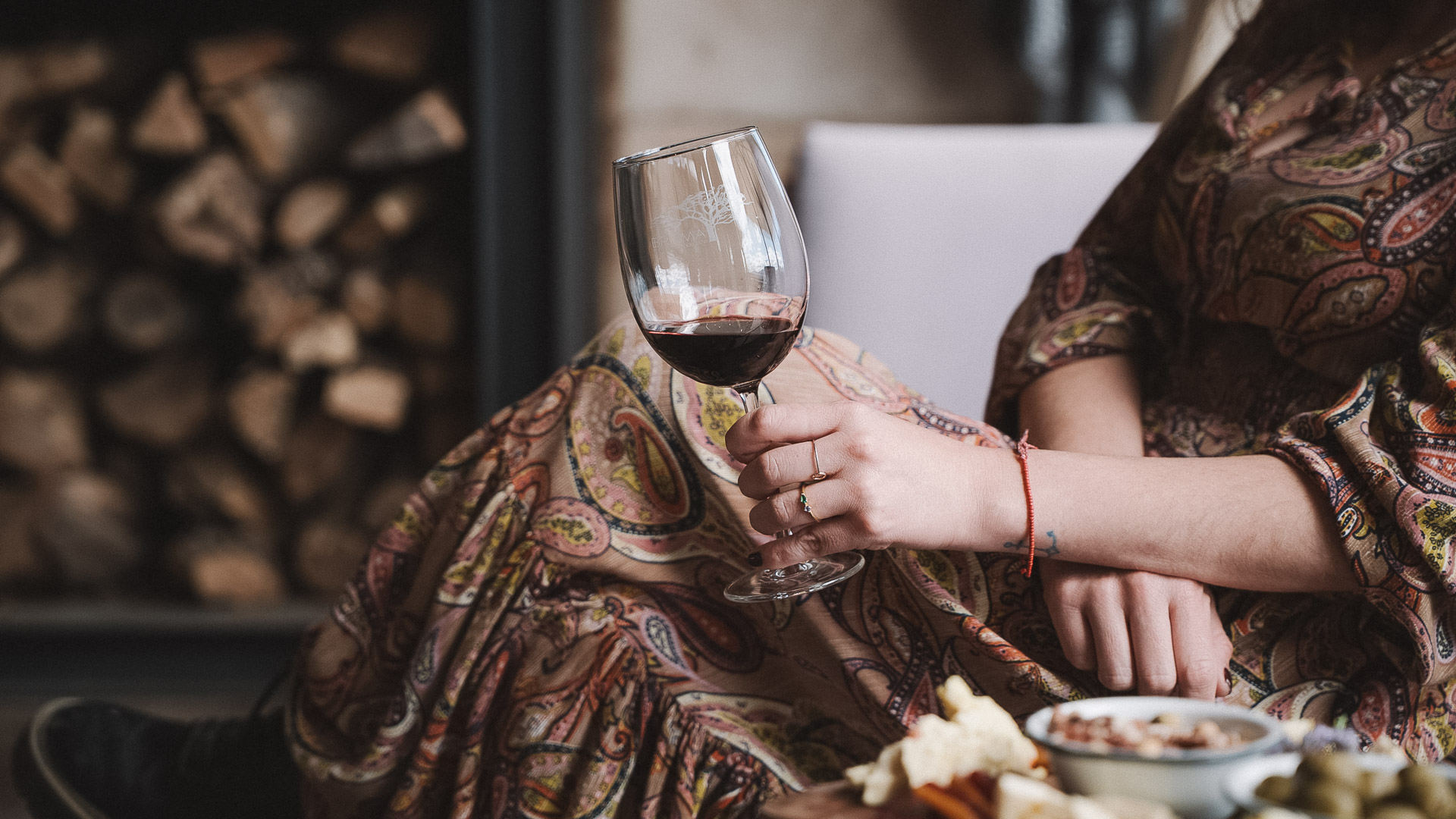 a woman holding a glass of wine