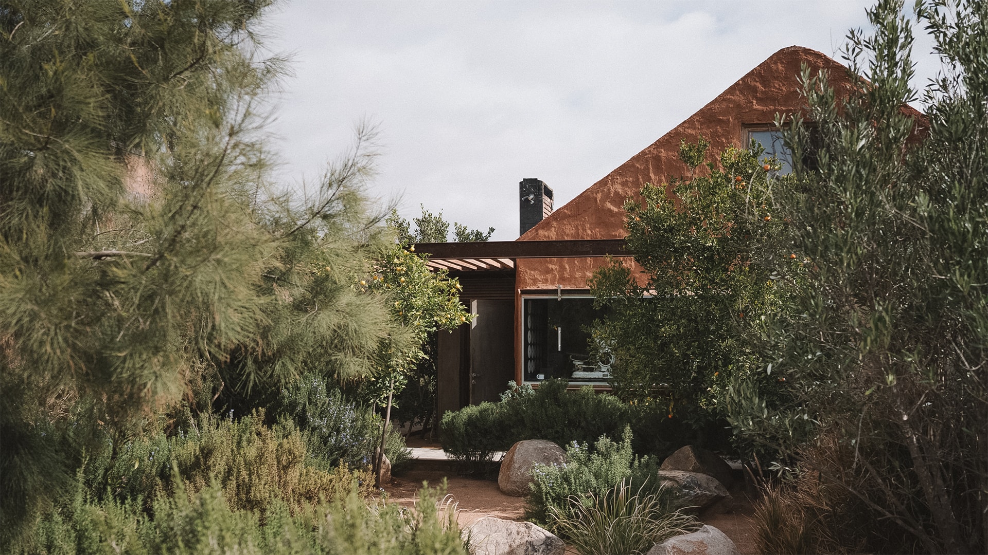 a house with a garden and trees
