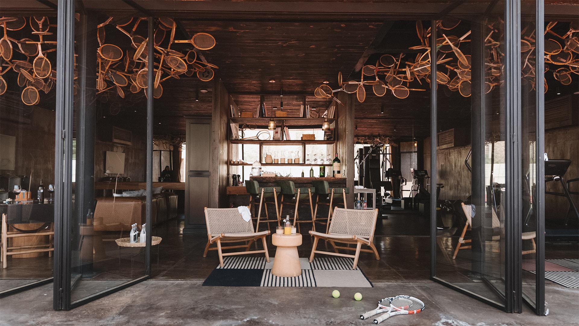 a room with chairs and tennis rackets