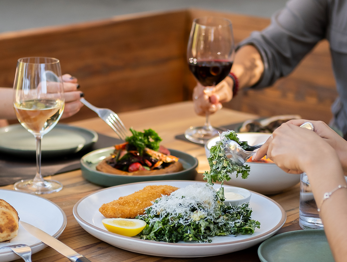 a group of people eating at a table