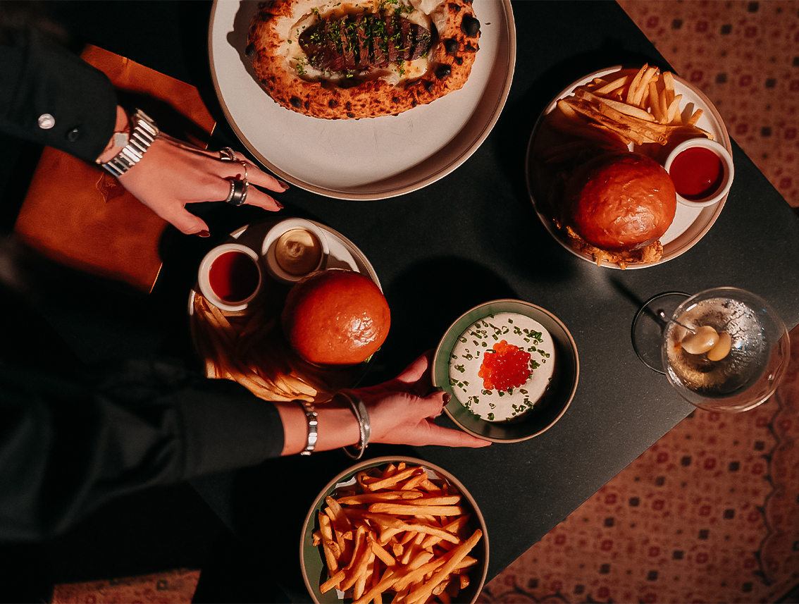 a person holding plates of food