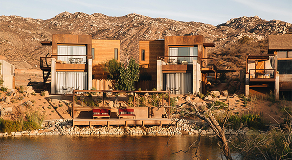 a house next to a body of water
