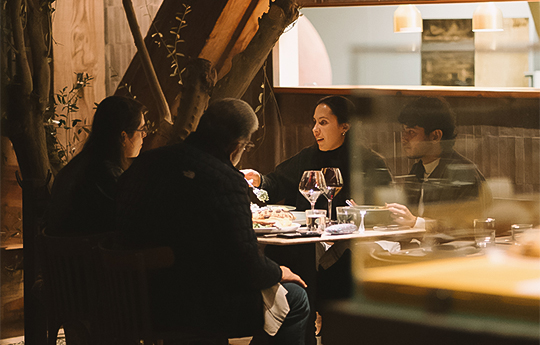 a group of people sitting at a table