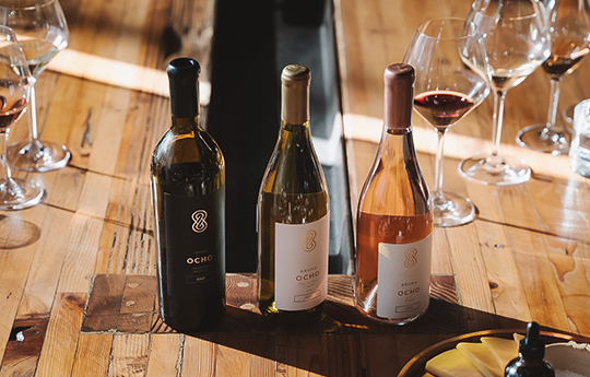 a group of bottles of wine on a table