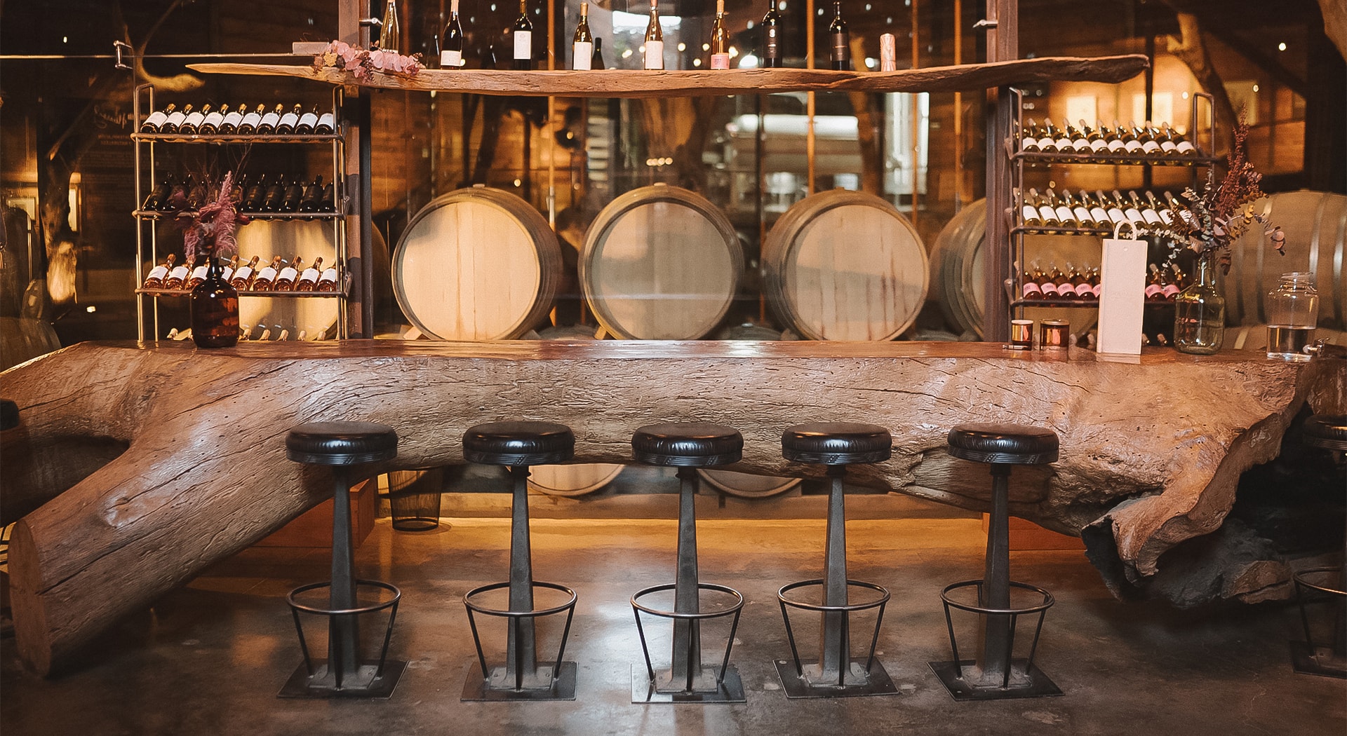 a group of stools in front of a bar