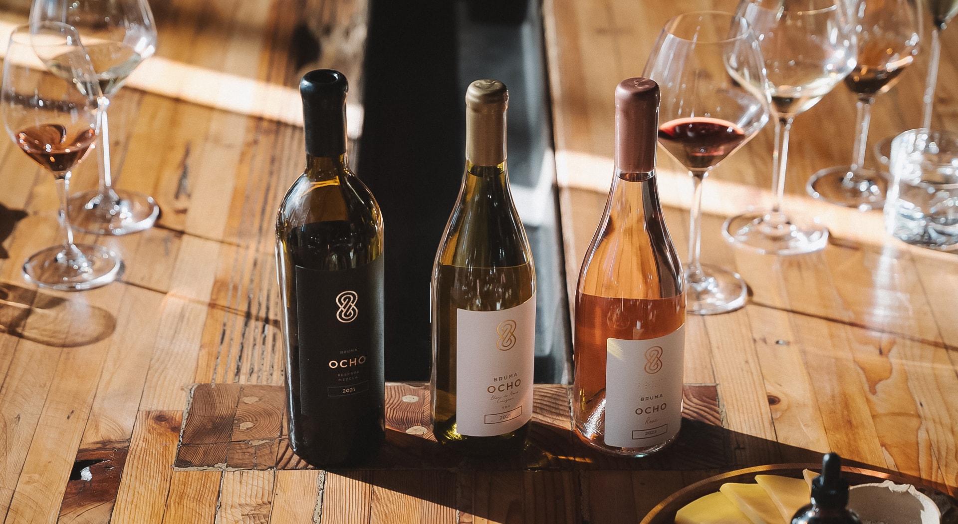 a group of wine bottles on a table
