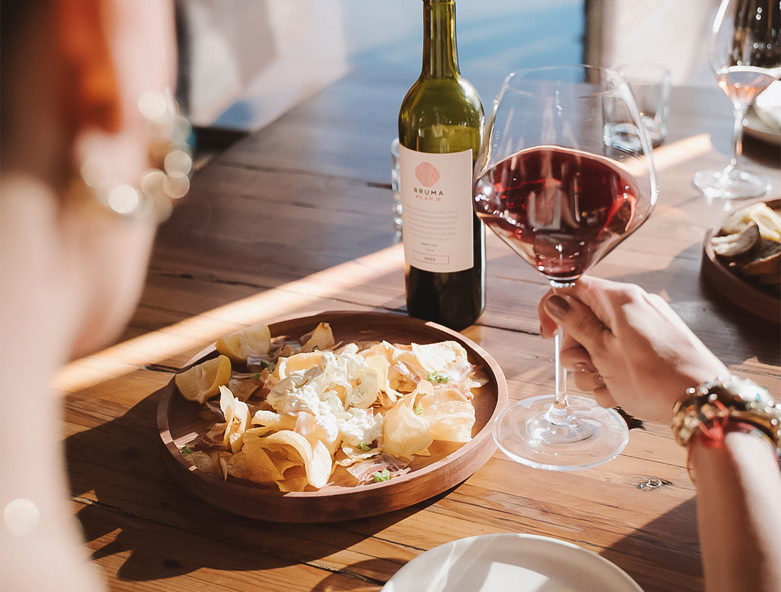 a person holding a glass of wine