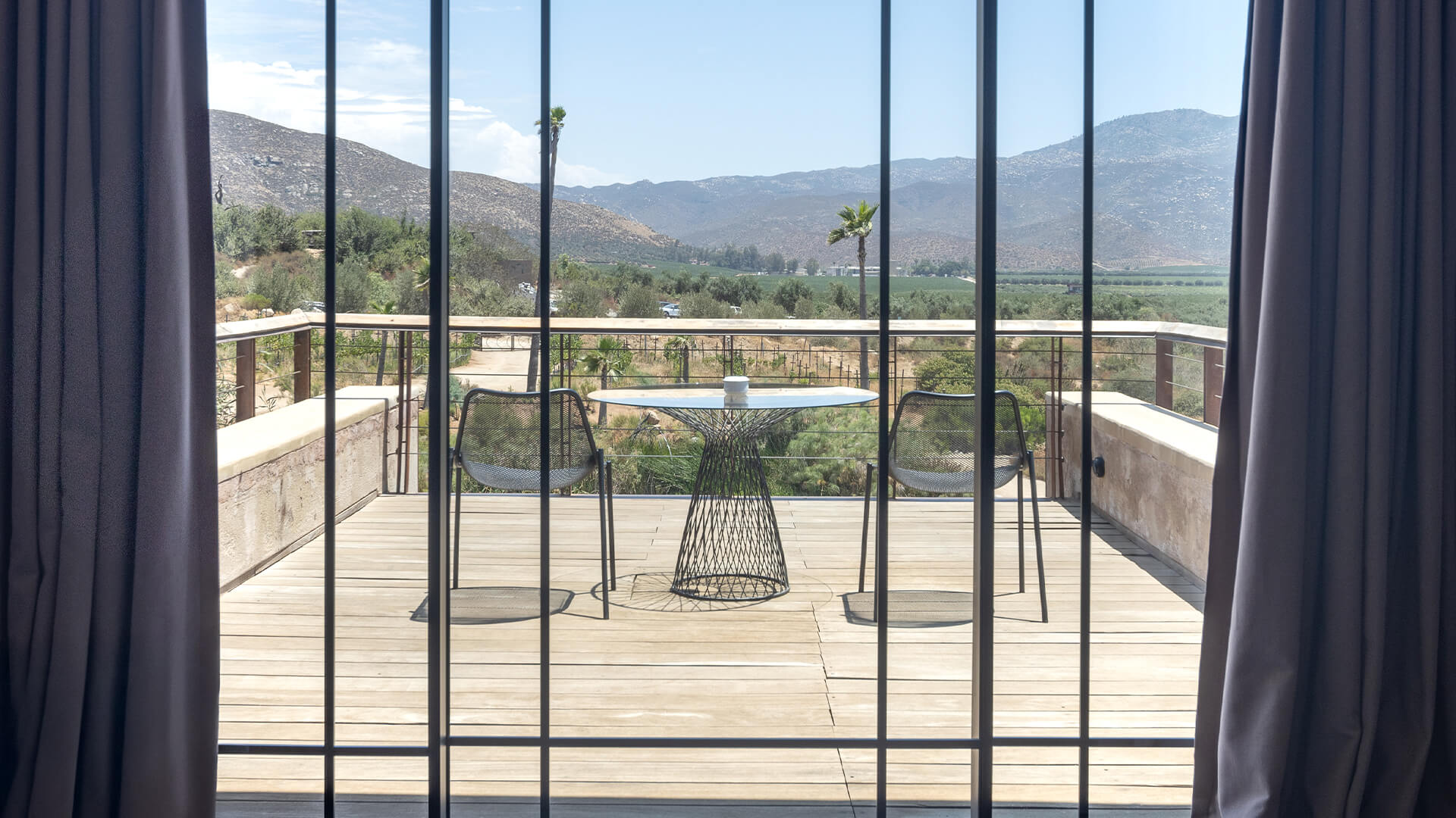 a table and chairs on a deck