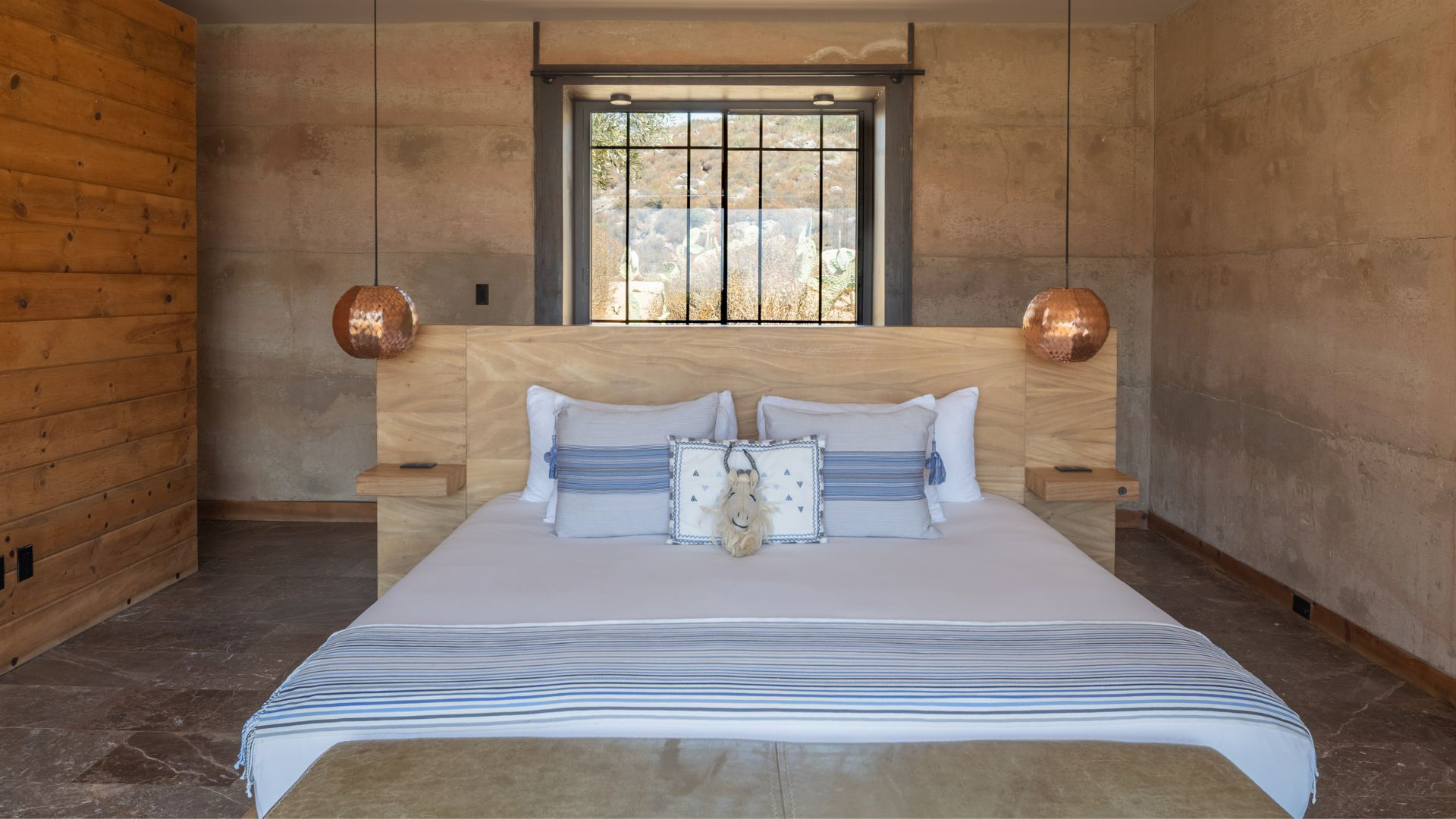 a bed with a stuffed animal on it