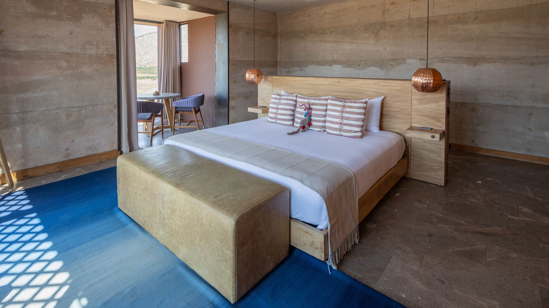 a bed with pillows in a room