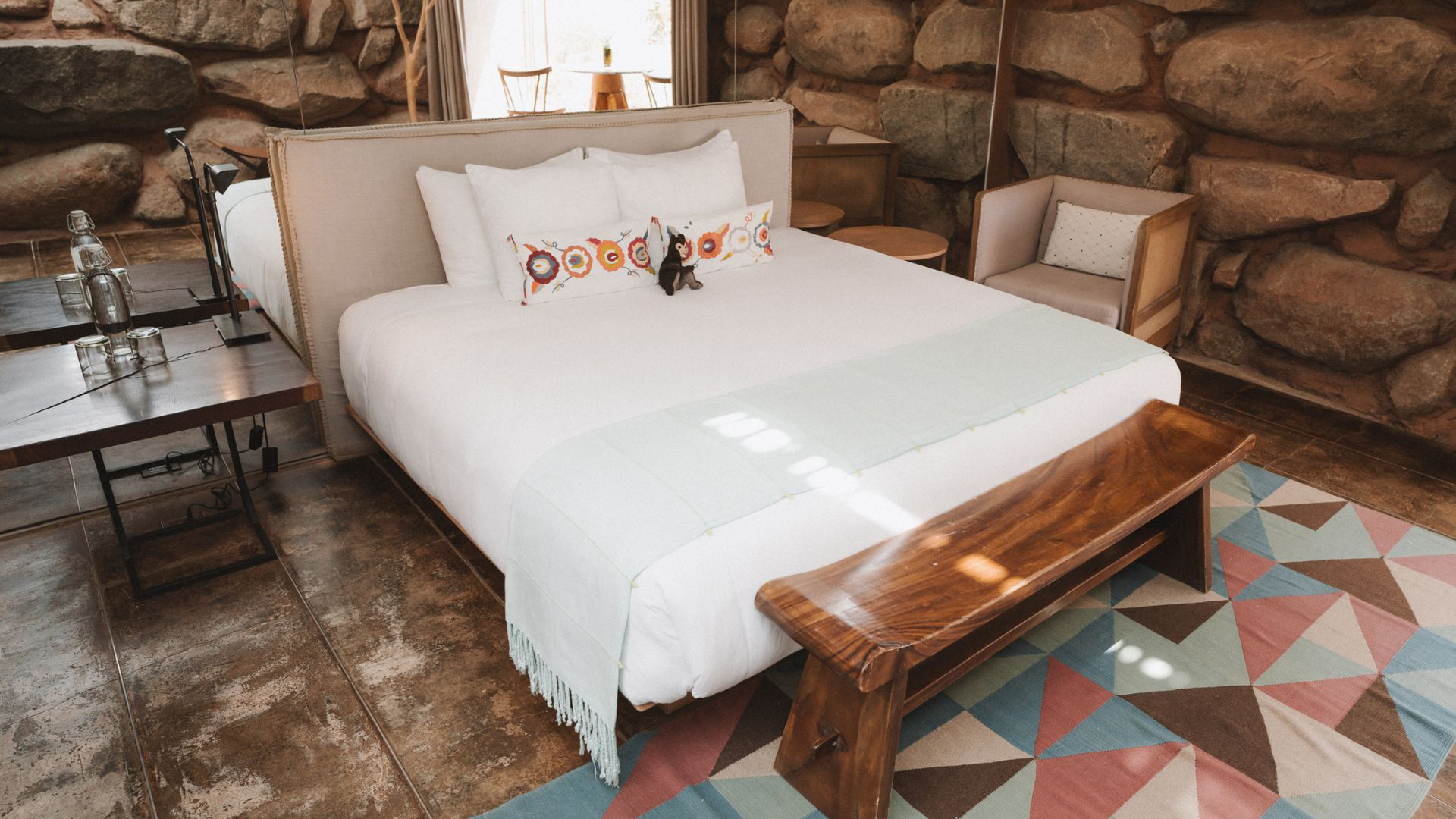 a cat sitting on a bed