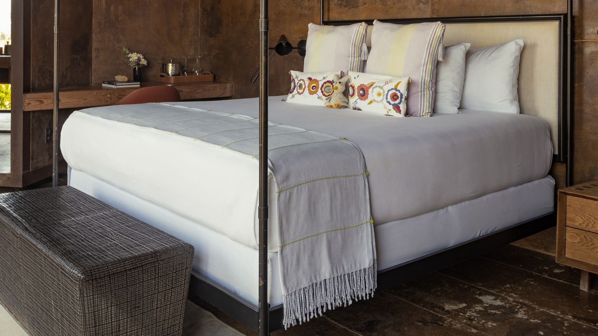 a bed with pillows and a blanket