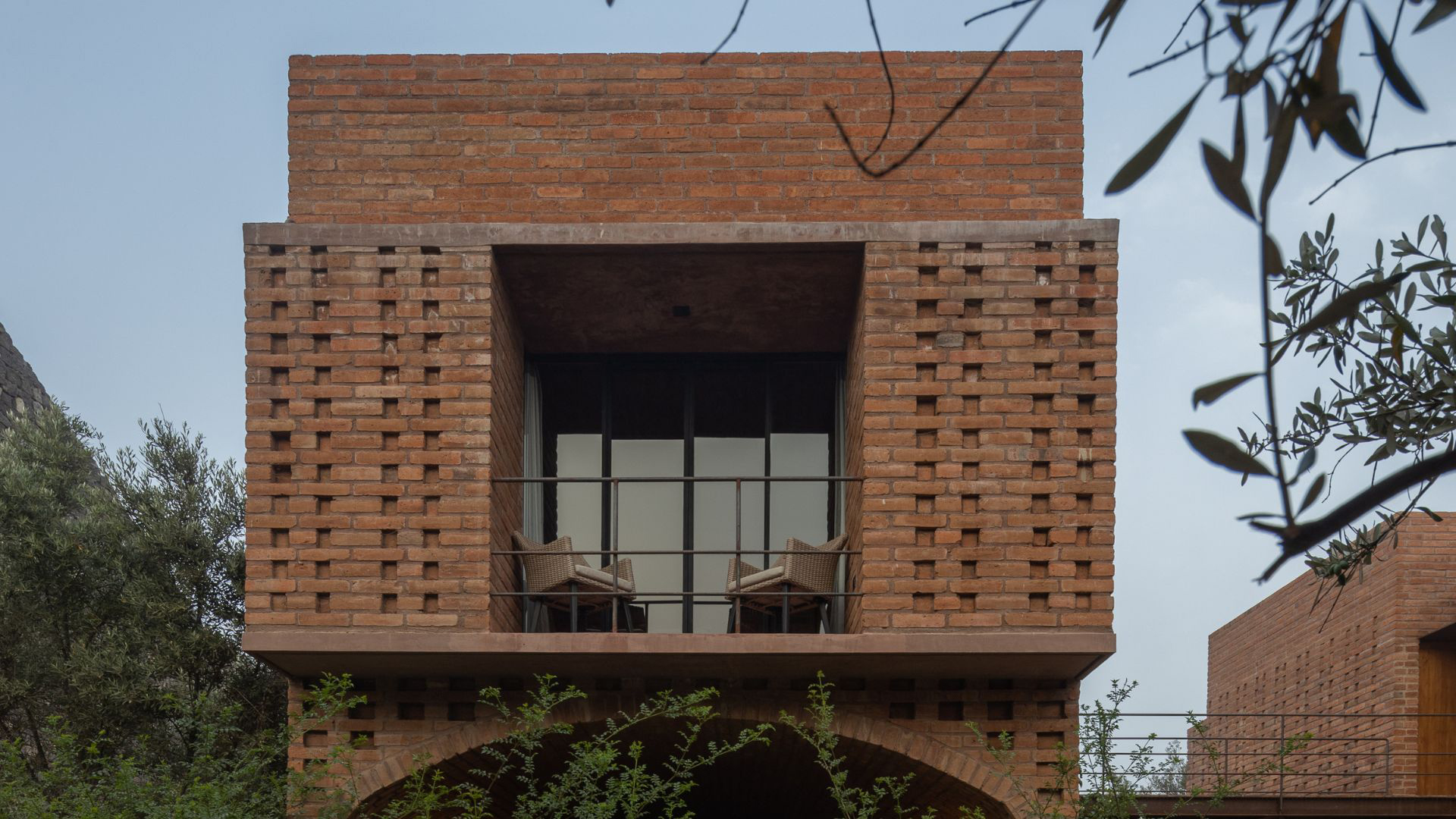 a brick building with a balcony