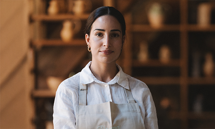 a woman wearing a white apron