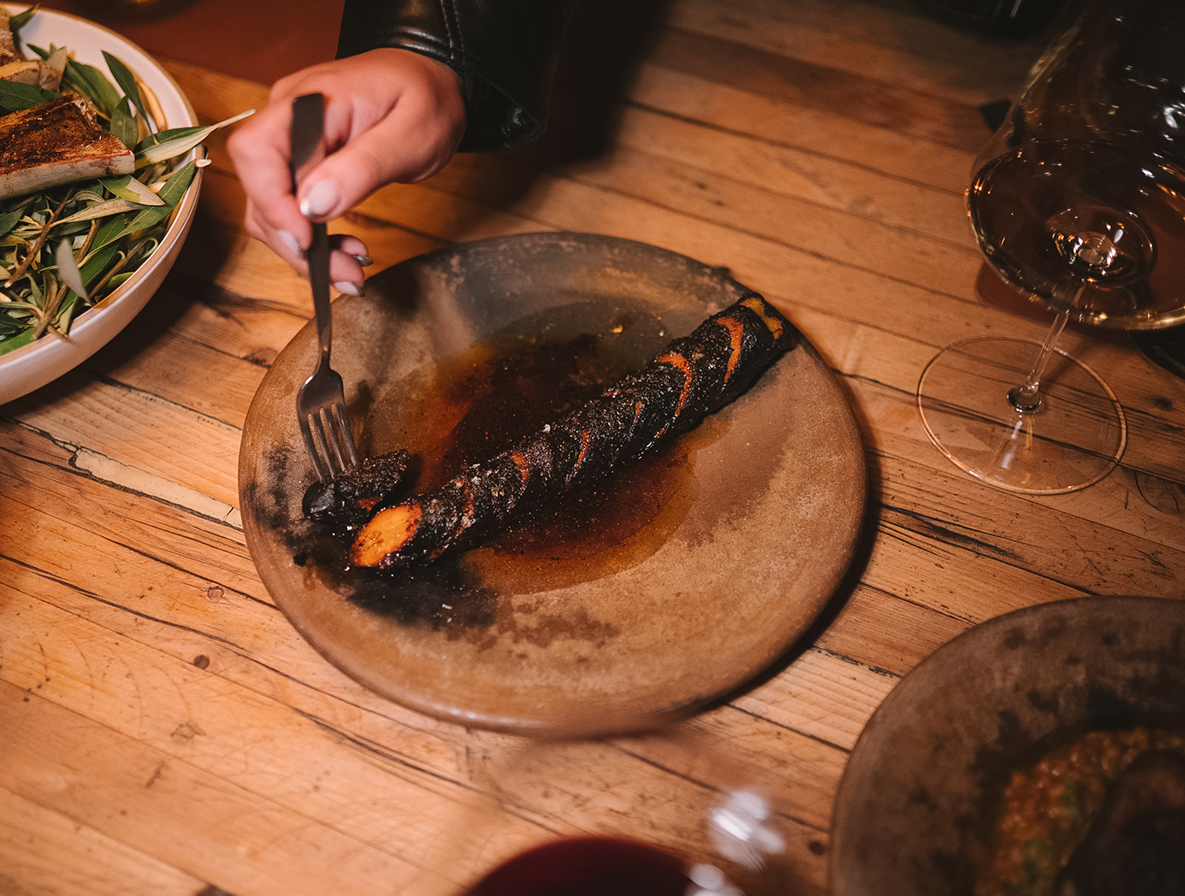 a person eating food on a plate
