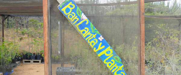 a blue sign with yellow writing on it