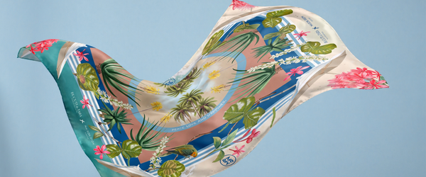 a colorful fabric with palm trees and birds