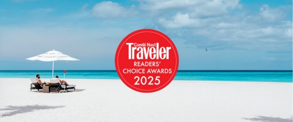 a red circle with white text on a beach