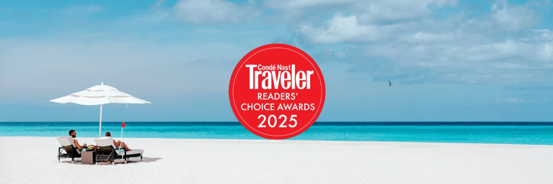 a red circle with white text over a beach