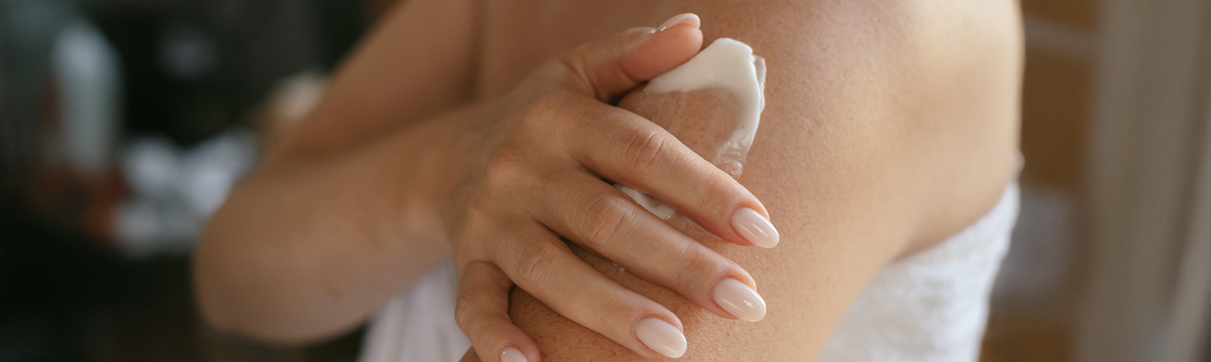 a person applying cream on their arm