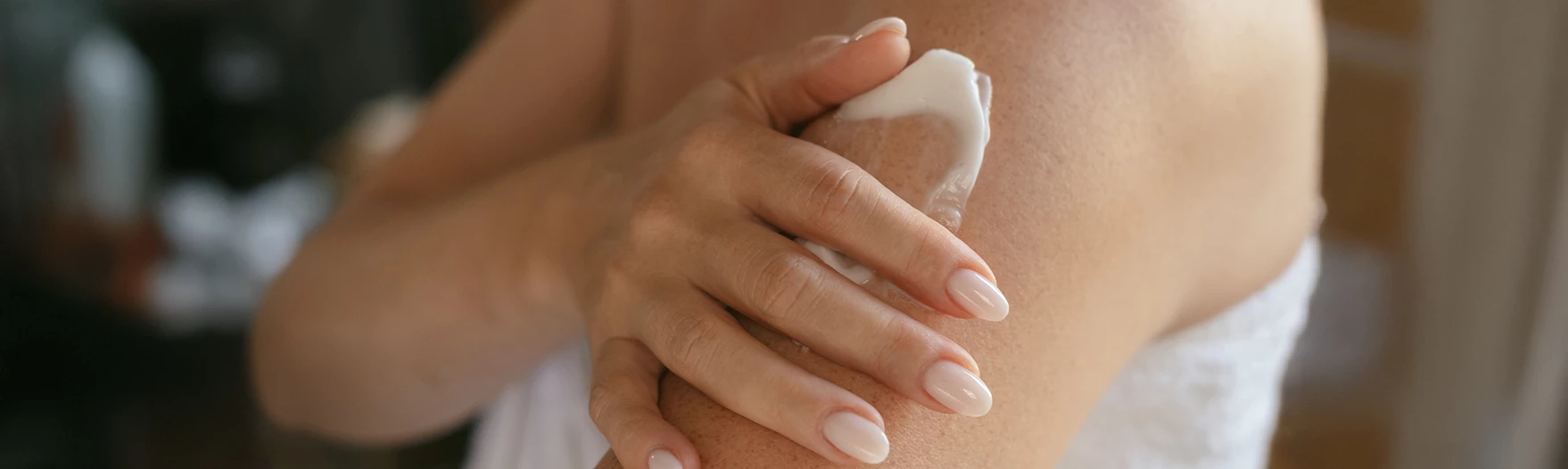 a person applying cream on their arm