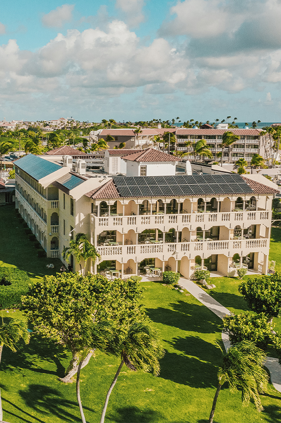 a building with a lawn and trees